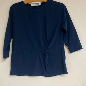 Three-quarter sleeve top for girls size 14. Excellent condition.